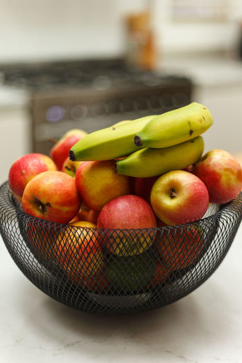 Close-up of fruits in basket on table
