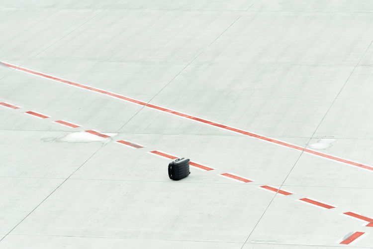 High angle view of suitcase on airport