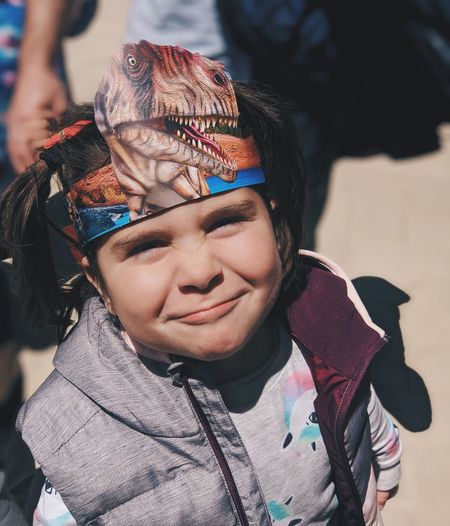 Portrait of smiling girl wearing headwear