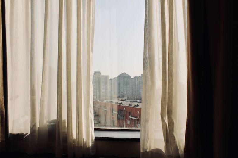 Buildings seen through window at home