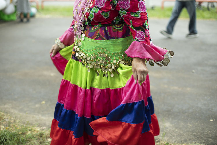 Folk costume. party on street. old-fashioned clothes. bright colors on fabric.