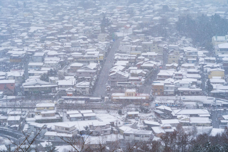 Aerial view of snow covered townscape