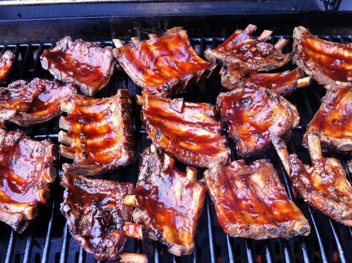 Close-up of food ribs on grill