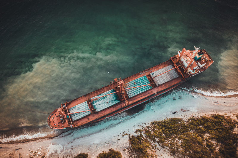Aerial view of abandoned ship in sea