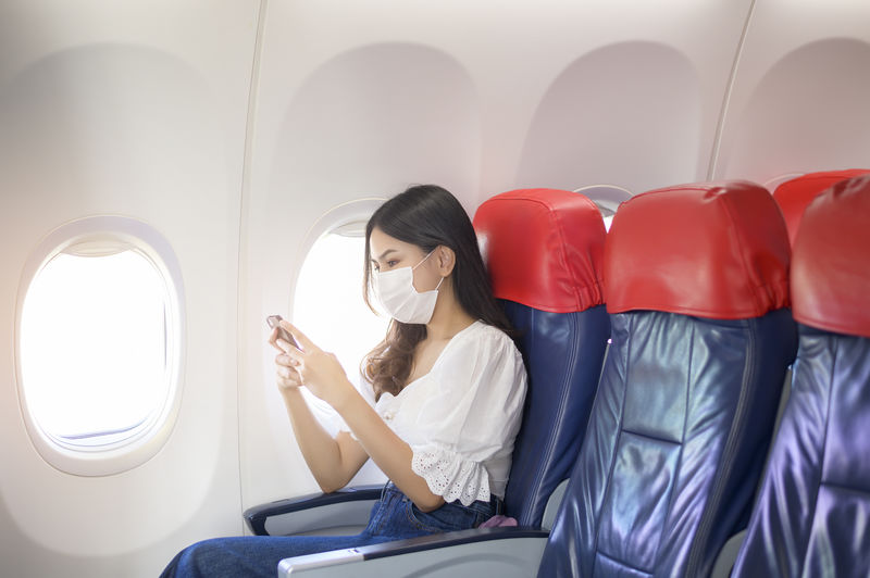 Woman sitting in airplane