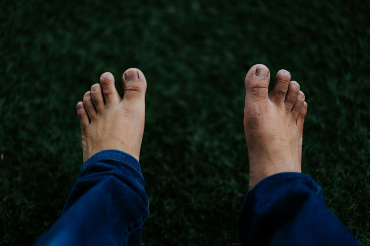 Low section of man legs on land