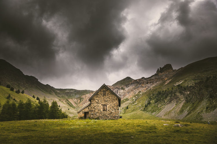 Panoramic shot of building on mountain against sky