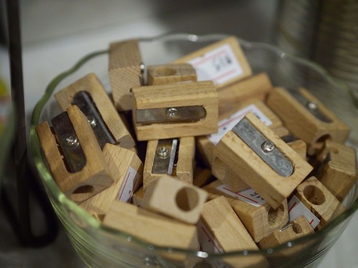 Close-up of wooden pencil sharpeners in bowl at home