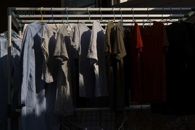 Clothes hanging in rack at store
