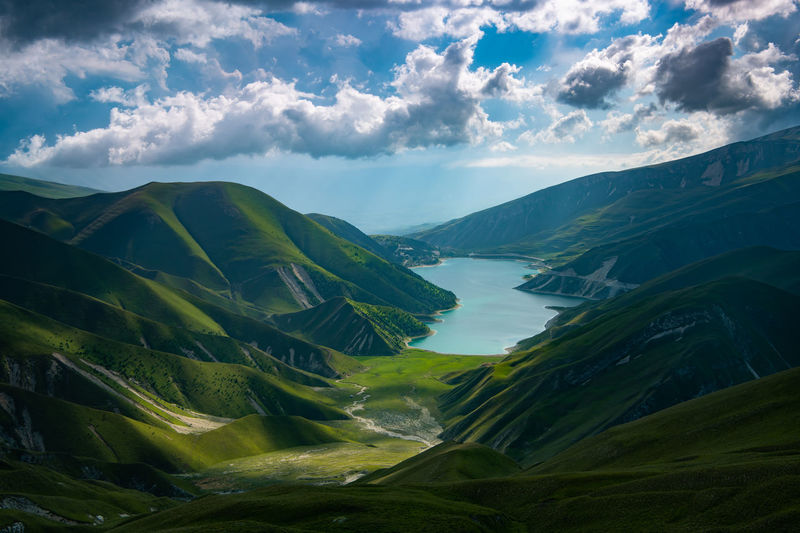 Lake kezenoy am in chechnya. scenic view of mountains against sky. 