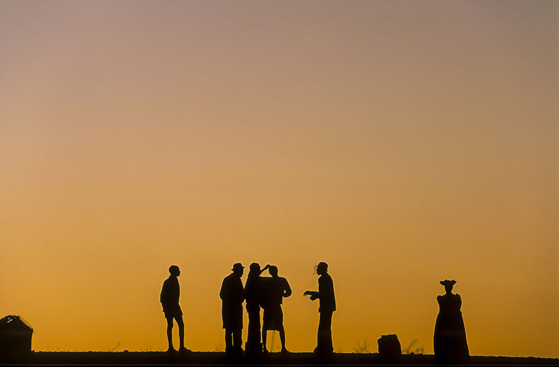 Backlight at the sunset of herero people in kaokoland, namibia