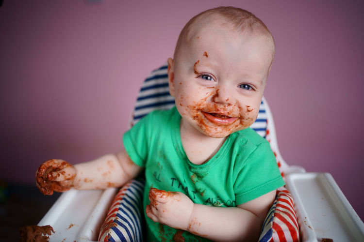 Baby stained in chocolate