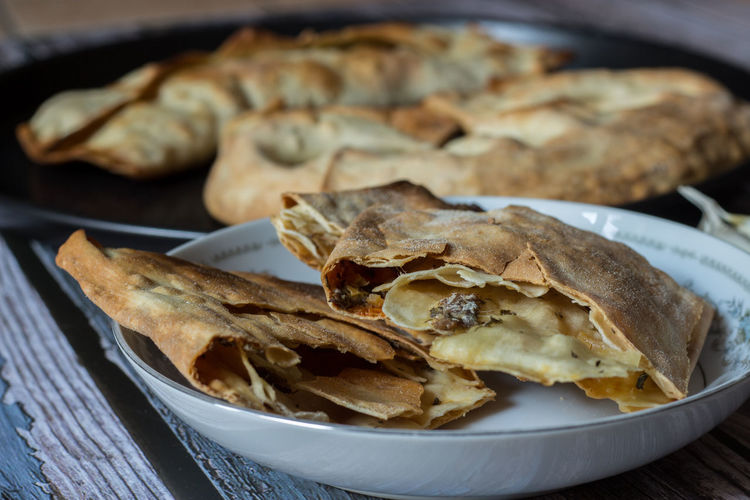 Pizza puff with anchovies. traditional peasant dish.