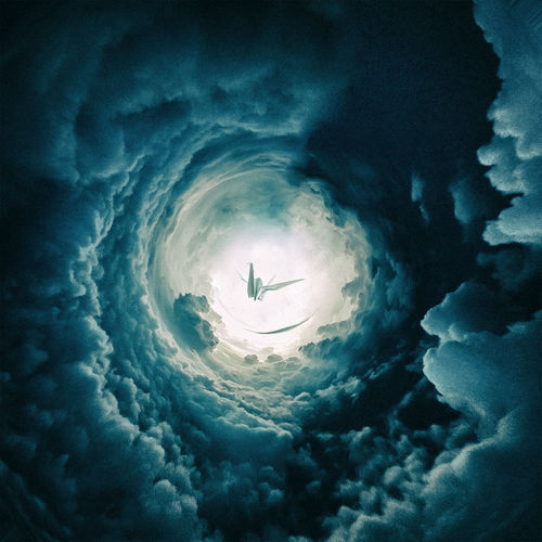 Digital composite image of paper crane amidst cloudy sky