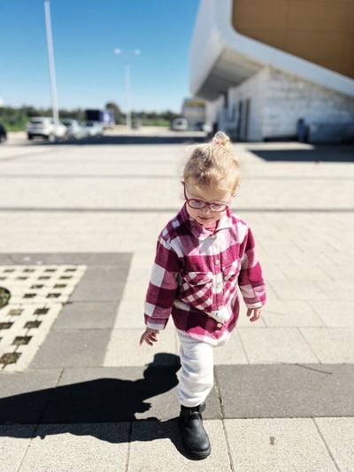 Portrait of boy standing on street