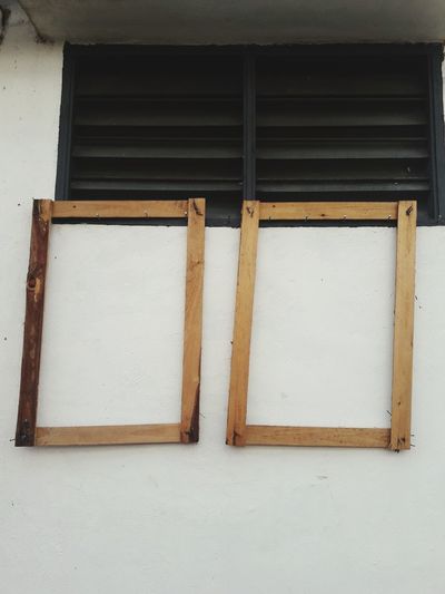 Close-up of closed window on white wall