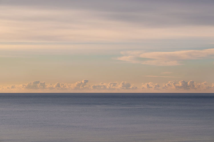 Scenic view of sea against sky during sunrise 