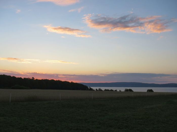 Scenic view of landscape against cloudy sky