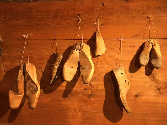 Close-up of shoe model hanging on wooden board