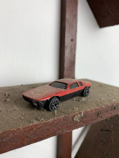 Close-up of toy on table against wall