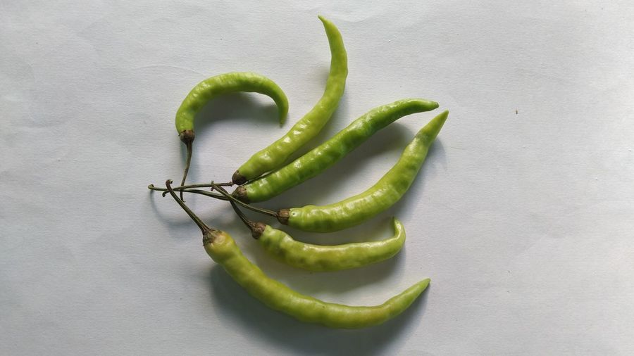 High angle view of green chili pepper on table