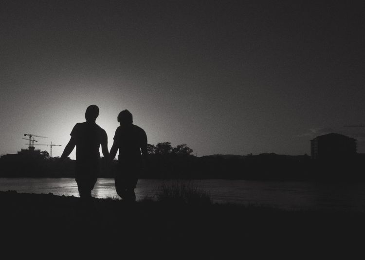 Silhouette of friends at sunset
