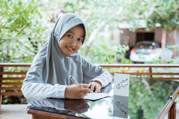 Portrait of smiling girl looking away