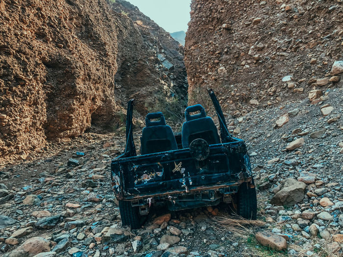 Old abandoned truck on rock