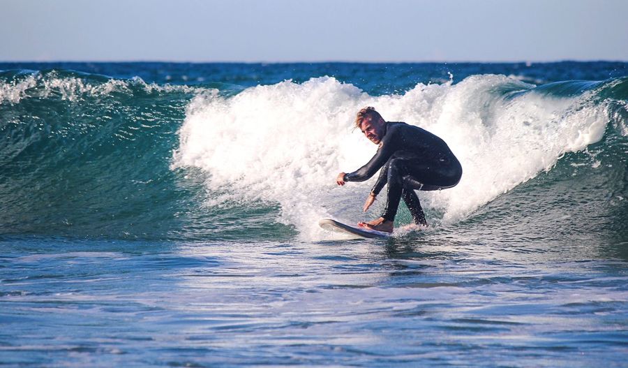 Man surfing on sea