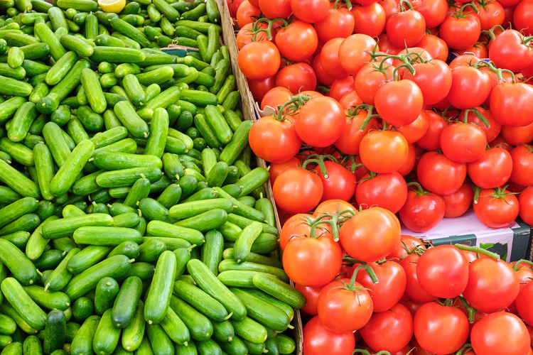 Pickled cucumber and tomatoes for sale at a market