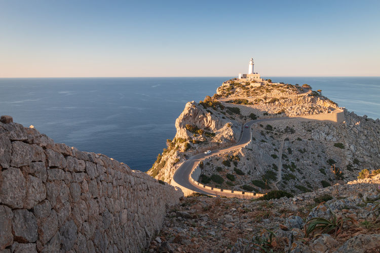 Scenic view of lighthouse of cap de formentor on majorca mallorca at sunset against sky