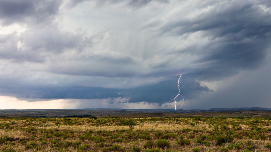 Lightning strikes from a supercell thunderstorm near roswell, new mexico.