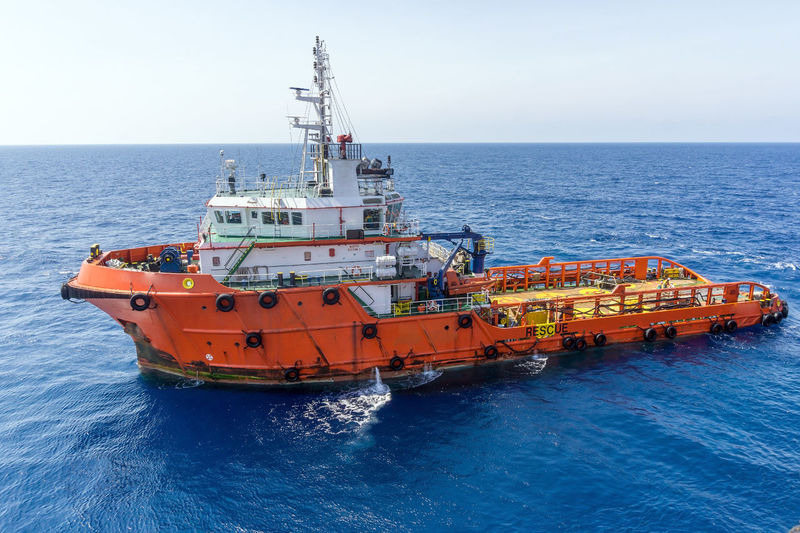 An anchor handling tug boat maneuvering at offshore terengganu oil field
