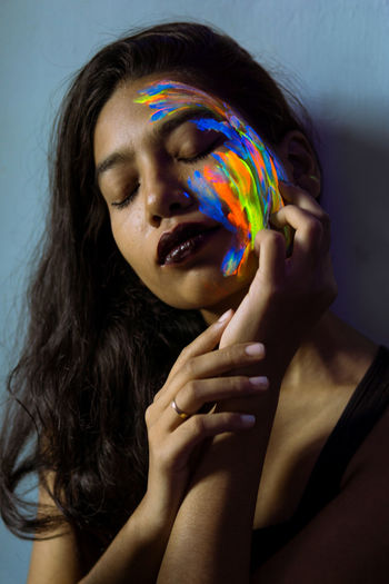 Close-up of young woman with face paint