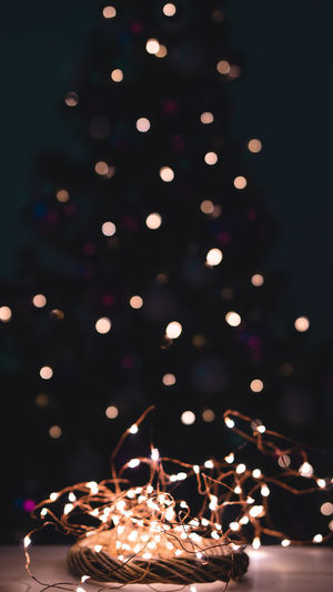 Illuminated christmas lights on table