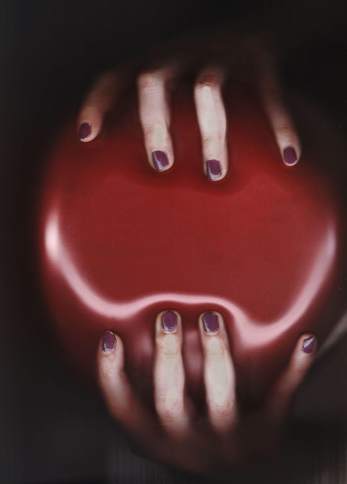 Close-up of hands holding balloon