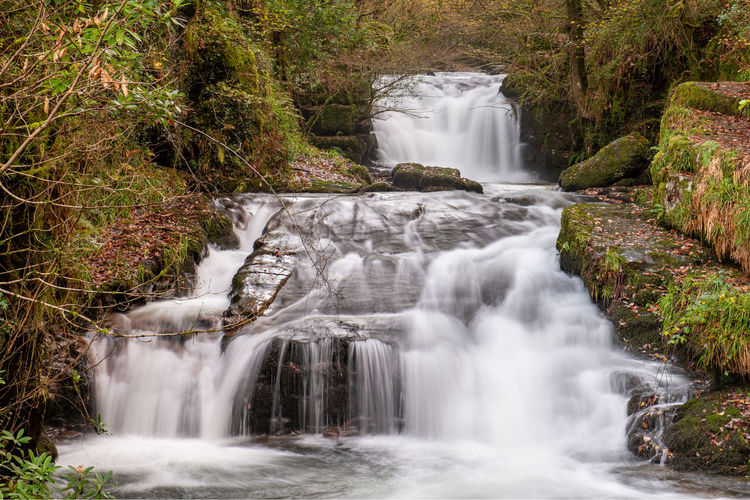 Long exposure of a the big waterfall at watersmmet in exmoor national park in autumn