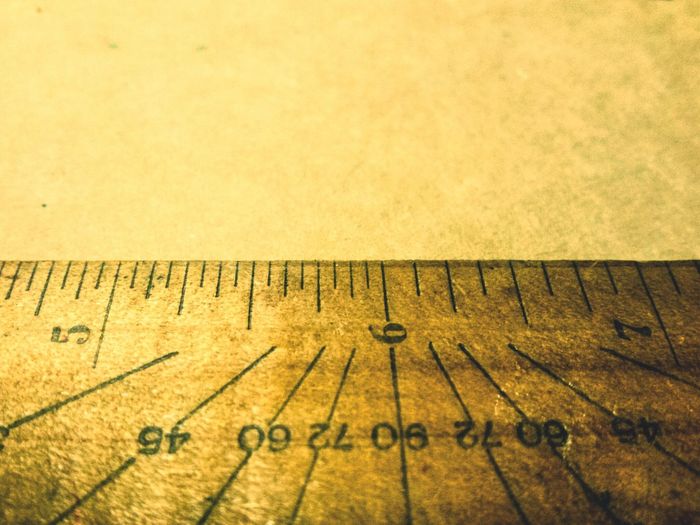 Close-up of wooden ruler on table