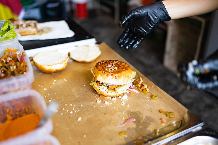 Cropped hand of person preparing food