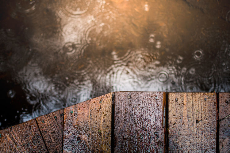Close-up of raindrops on lake
