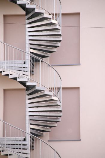 Low angle view of spiral staircase against building