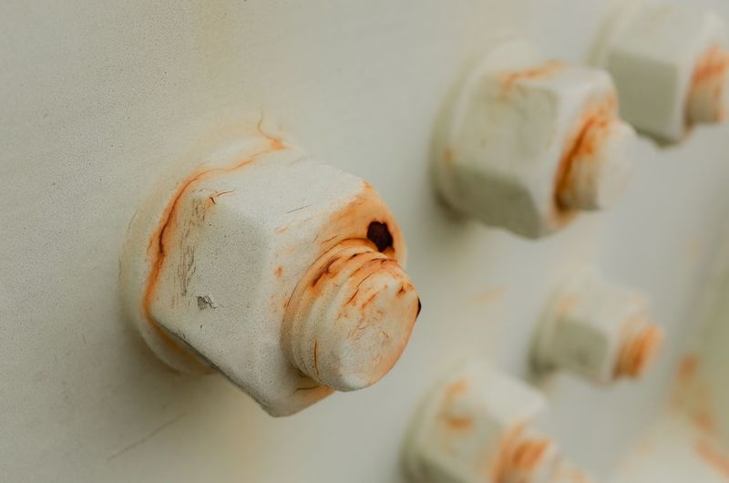 Close-up of rusty nuts and bolts