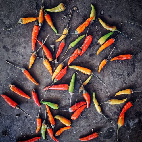 Directly above shot of chili peppers on slate