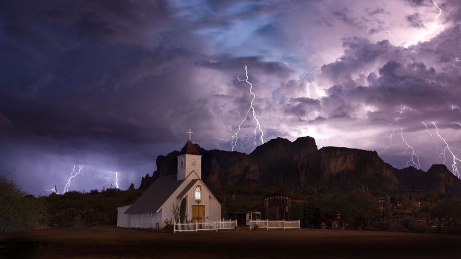 A late monsoon storm rolls over the superstition mountains just outside of phoenix, arizona.