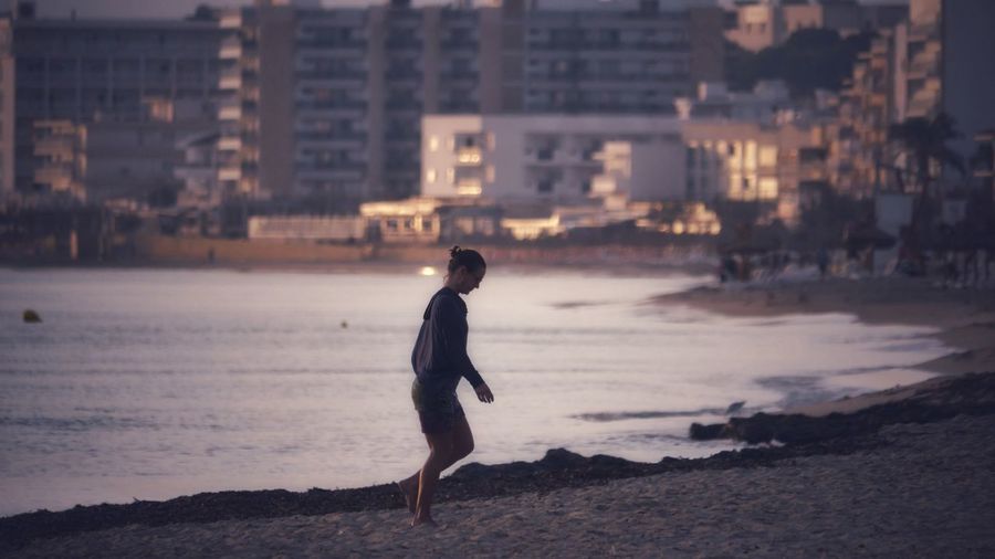 Full length of man standing on beach