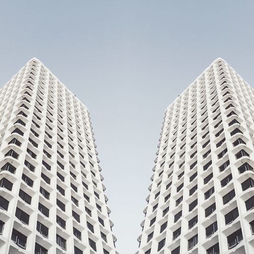Low angle view of skyscrapers against clear sky