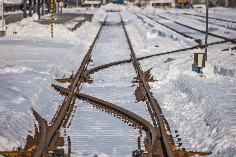 High angle view of frozen railway tracks  during winter