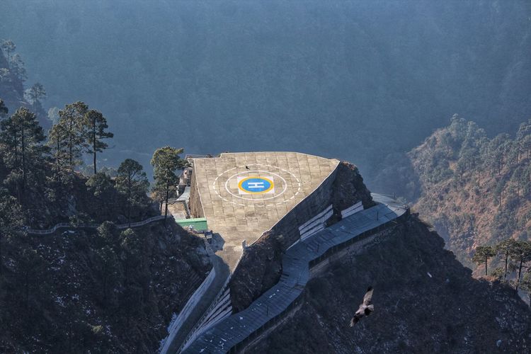 High angle view of helipad station over mountains