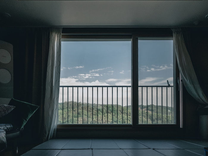 Scenic view of mountain seen through window