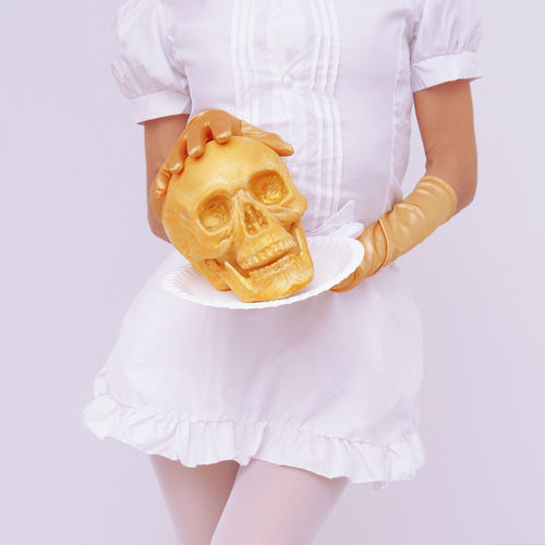 Candy girl in a waiter costume with gold skull. role-playing games, halloween
